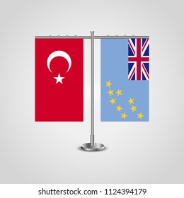 Table stand with flags of Turkey and Tuvalu.Two flag. Flag pole. Symbolizing the cooperation between the two countries. Table flags