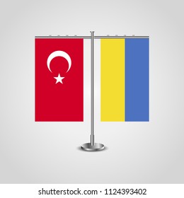 Table stand with flags of Turkey and Ukraine.Two flag. Flag pole. Symbolizing the cooperation between the two countries. Table flags