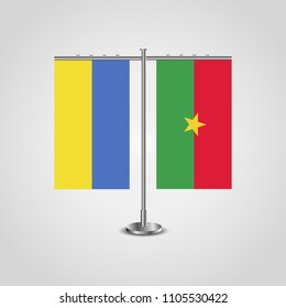 Table stand with flags of Ukraine and Burkina Faso.Two flag. Flag pole. Symbolizing the cooperation between the two countries. Table flags