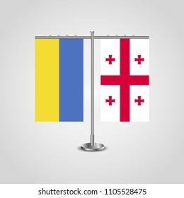 Table stand with flags of Ukraine and Georgia.Two flag. Flag pole. Symbolizing the cooperation between the two countries. Table flags