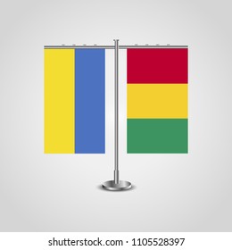 Table stand with flags of Ukraine and Guinea.Two flag. Flag pole. Symbolizing the cooperation between the two countries. Table flags