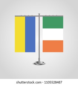 Table stand with flags of Ukraine and Ireland.Two flag. Flag pole. Symbolizing the cooperation between the two countries. Table flags