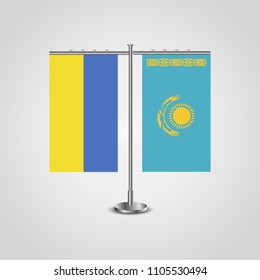 Table stand with flags of Ukraine and Kazakhstan.Two flag. Flag pole. Symbolizing the cooperation between the two countries. Table flags