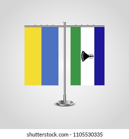 Table stand with flags of Ukraine and Lesotho.Two flag. Flag pole. Symbolizing the cooperation between the two countries. Table flags