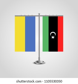 Table stand with flags of Ukraine and Libya.Two flag. Flag pole. Symbolizing the cooperation between the two countries. Table flags