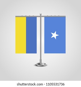 Table stand with flags of Ukraine and Somalia.Two flag. Flag pole. Symbolizing the cooperation between the two countries. Table flags
