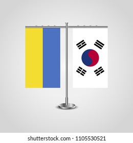 Table stand with flags of Ukraine and South Korea.Two flag. Flag pole. Symbolizing the cooperation between the two countries. Table flags