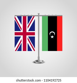 Table stand with flags of United Kingdom and Libya.Two flag. Flag pole. Symbolizing the cooperation between the two countries. Table flags