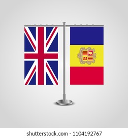 Table stand with flags of United Kingdom and Andorra.Two flag. Flag pole. Symbolizing the cooperation between the two countries. Table flags