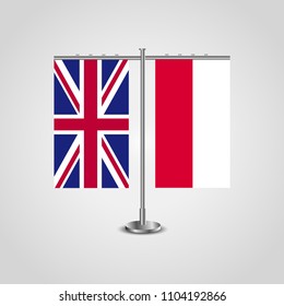 Table stand with flags of United Kingdom and Poland.Two flag. Flag pole. Symbolizing the cooperation between the two countries. Table flags