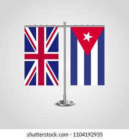 Table stand with flags of United Kingdom and Cuba.Two flag. Flag pole. Symbolizing the cooperation between the two countries. Table flags