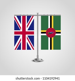 Table stand with flags of United Kingdom and Dominica.Two flag. Flag pole. Symbolizing the cooperation between the two countries. Table flags