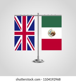 Table stand with flags of United Kingdom and Mexico.Two flag. Flag pole. Symbolizing the cooperation between the two countries. Table flags