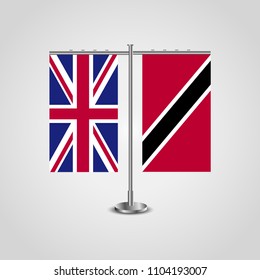 Table stand with flags of United Kingdom and Trinidad and Tobago.Two flag. Flag pole. Symbolizing the cooperation between the two countries. Table flags