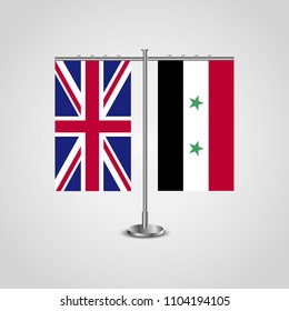Table stand with flags of United Kingdom and Syria.Two flag. Flag pole. Symbolizing the cooperation between the two countries. Table flags