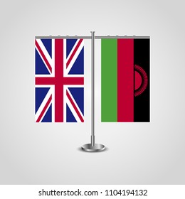 Table stand with flags of United Kingdom and Malawi.Two flag. Flag pole. Symbolizing the cooperation between the two countries. Table flags