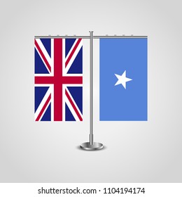 Table stand with flags of United Kingdom and Somalia.Two flag. Flag pole. Symbolizing the cooperation between the two countries. Table flags