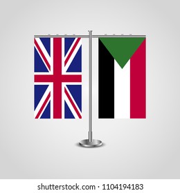 Table stand with flags of United Kingdom and Sudan.Two flag. Flag pole. Symbolizing the cooperation between the two countries. Table flags