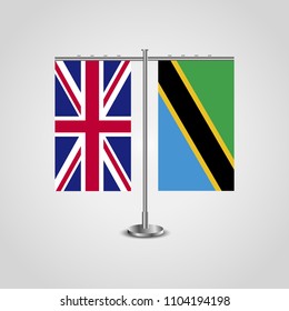 Table stand with flags of United Kingdom and Tanzania.Two flag. Flag pole. Symbolizing the cooperation between the two countries. Table flags