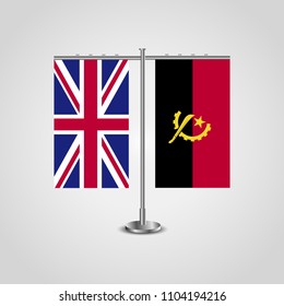 Table stand with flags of United Kingdom and Angola.Two flag. Flag pole. Symbolizing the cooperation between the two countries. Table flags
