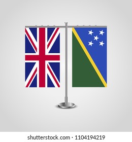 Table stand with flags of United Kingdom and Solomon islands.Two flag. Flag pole. Symbolizing the cooperation between the two countries. Table flags