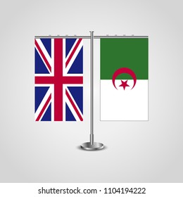Table stand with flags of United Kingdom and Algeria.Two flag. Flag pole. Symbolizing the cooperation between the two countries. Table flags