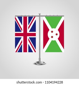 Table stand with flags of United Kingdom and Burundi.Two flag. Flag pole. Symbolizing the cooperation between the two countries. Table flags