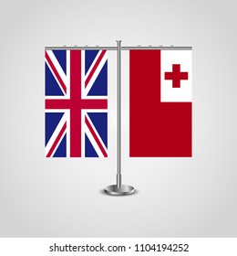 Table stand with flags of United Kingdom and Tonga.Two flag. Flag pole. Symbolizing the cooperation between the two countries. Table flags