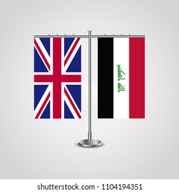 Table stand with flags of United Kingdom and Iraq.Two flag. Flag pole. Symbolizing the cooperation between the two countries. Table flags