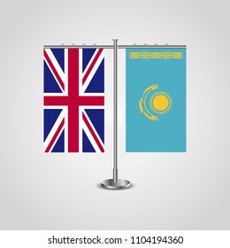 Table stand with flags of United Kingdom and Kazakhstan.Two flag. Flag pole. Symbolizing the cooperation between the two countries. Table flags