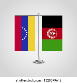 Table stand with flags of Venezuela and Afghanistan. Two flag. Flag pole. Symbolizing the cooperation between the two countries. Table flags