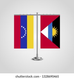 Table stand with flags of Venezuela and Antigua and Barbuda. Two flag. Flag pole. Symbolizing the cooperation between the two countries. Table flags

