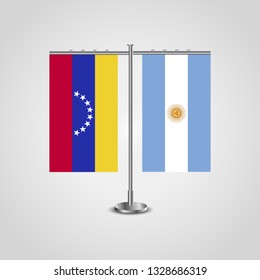 Table stand with flags of Venezuela and Argentina. Two flag. Flag pole. Symbolizing the cooperation between the two countries. Table flags