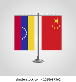 Table stand with flags of Venezuela and China. Two flag. Flag pole. Symbolizing the cooperation between the two countries. Table flags