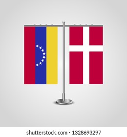 Table stand with flags of Venezuela and Denmark. Two flag. Flag pole. Symbolizing the cooperation between the two countries. Table flags