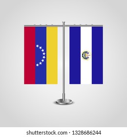 Table stand with flags of Venezuela and El Salvador. Two flag. Flag pole. Symbolizing the cooperation between the two countries. Table flags