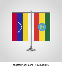 Table stand with flags of Venezuela and Ethiopia. Two flag. Flag pole. Symbolizing the cooperation between the two countries. Table flags