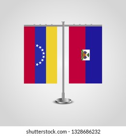 Table stand with flags of Venezuela and Haiti. Two flag. Flag pole. Symbolizing the cooperation between the two countries. Table flags