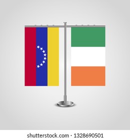 Table stand with flags of Venezuela and Ireland. Two flag. Flag pole. Symbolizing the cooperation between the two countries. Table flags

