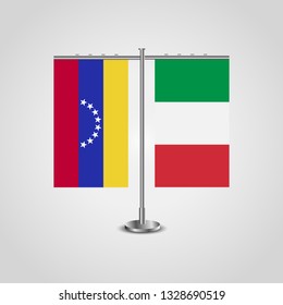Table stand with flags of Venezuela and Italy. Two flag. Flag pole. Symbolizing the cooperation between the two countries. Table flags

