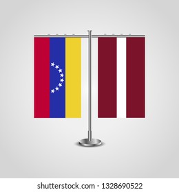 Table stand with flags of Venezuela and Latvia. Two flag. Flag pole. Symbolizing the cooperation between the two countries. Table flags
