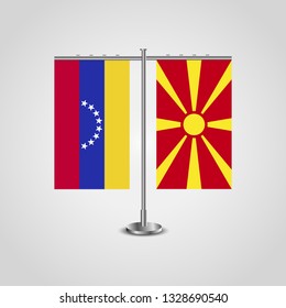 Table stand with flags of Venezuela and Macedonia. Two flag. Flag pole. Symbolizing the cooperation between the two countries. Table flags

