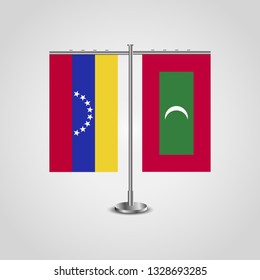 Table stand with flags of Venezuela and Maldives. Two flag. Flag pole. Symbolizing the cooperation between the two countries. Table flags

