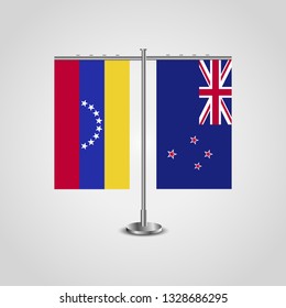 Table stand with flags of Venezuela and New Zealand. Two flag. Flag pole. Symbolizing the cooperation between the two countries. Table flags