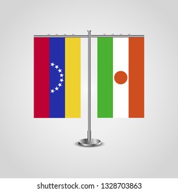 Table stand with flags of Venezuela and Niger. Two flag. Flag pole. Symbolizing the cooperation between the two countries. Table flags


