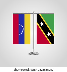 Table stand with flags of Venezuela and Saint Kitts and Nevis. Two flag. Flag pole. Symbolizing the cooperation between the two countries. Table flags

