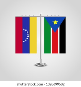 Table stand with flags of Venezuela and Southern Sudan. Two flag. Flag pole. Symbolizing the cooperation between the two countries. Table flags

