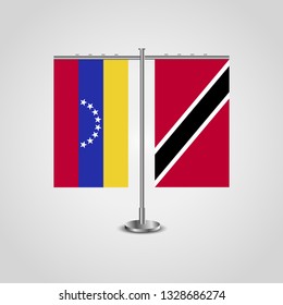 Table stand with flags of Venezuela and Trinidad and Tobago. Two flag. Flag pole. Symbolizing the cooperation between the two countries. Table flags