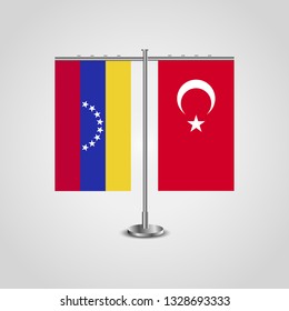 Table stand with flags of Venezuela and Turkey. Two flag. Flag pole. Symbolizing the cooperation between the two countries. Table flags

