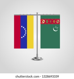 Table stand with flags of Venezuela and Turkmenistan. Two flag. Flag pole. Symbolizing the cooperation between the two countries. Table flags

